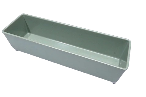 Rectangular sage green organizing tray with elevated feet for tidy storage in home or office settings