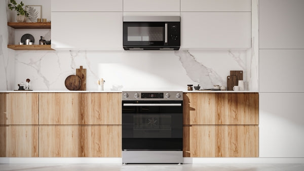 Electric freestanding range with stainless steel finish and digital controls in modern kitchen with wood lower cabinets and white upper shelves