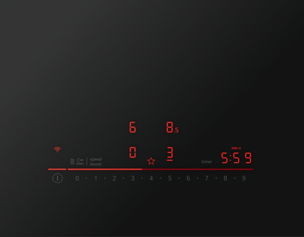 Close-up of digital touch control panel on induction cooktop showing power levels, timer, and indicator icons in red light