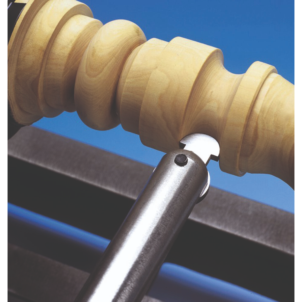Steel hollowing tip shaping detailed grooves on a turned wooden spindle for woodworking and home improvement tasks