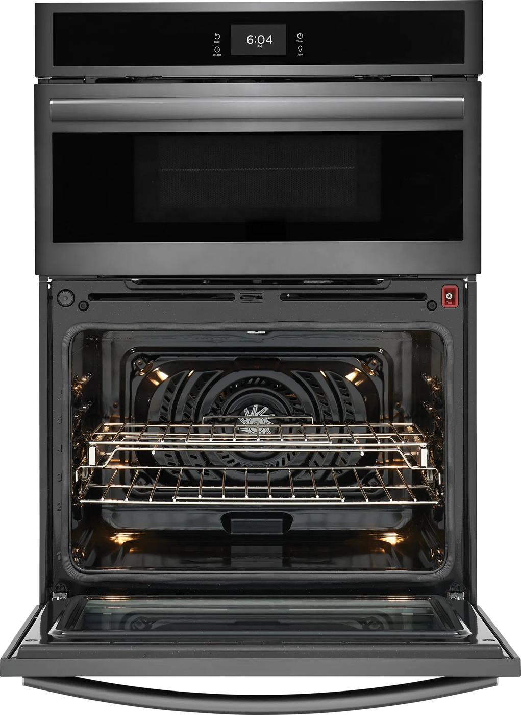 Stainless steel microwave and electric wall oven combo with digital clock and open convection oven door showing interior racks