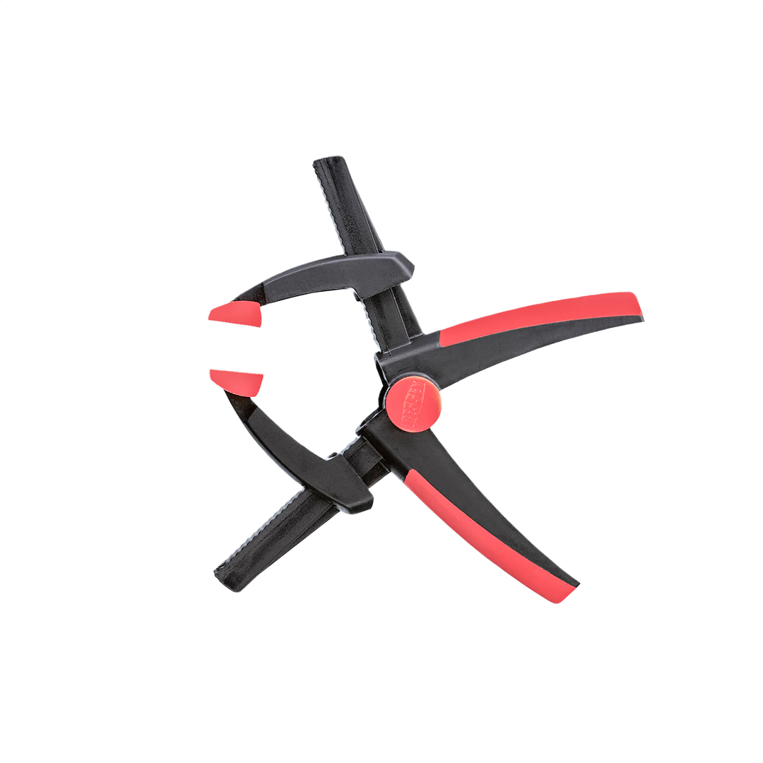 Compact black and red spring clamp with adjustable jaws for versatile home improvement and woodworking tasks
