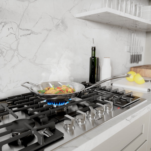 Stainless steel gas cooktop with five burners and simmering pan in modern kitchenware collection