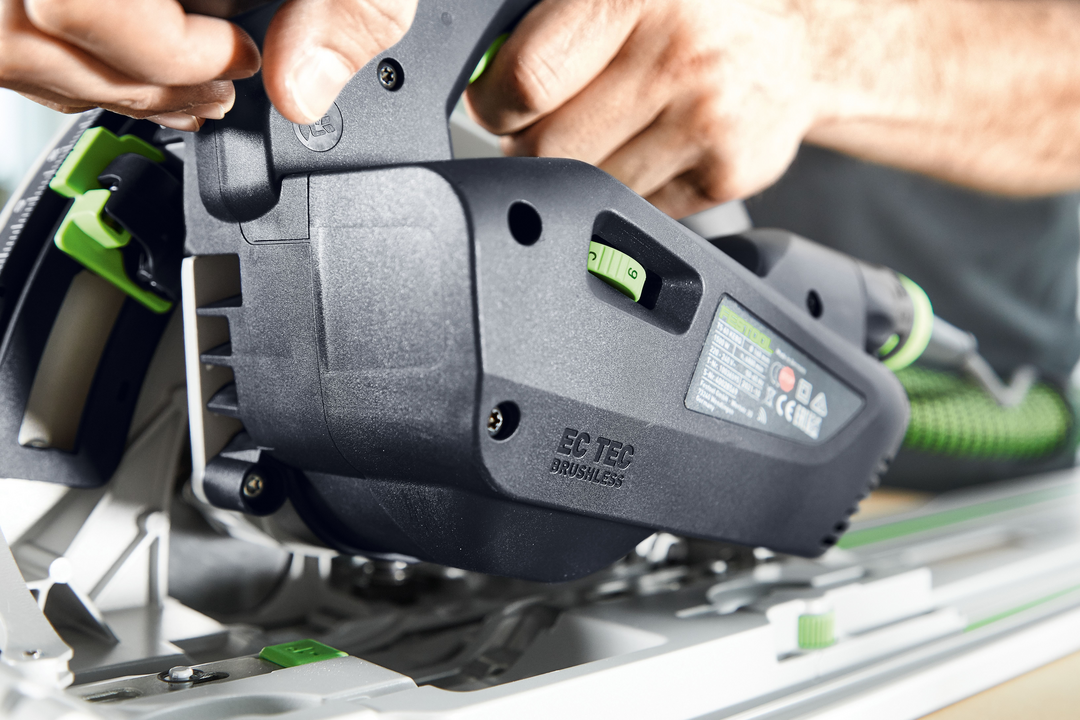 Close-up of a Festool plunge cut track saw being adjusted for a precise cut in electric power tools collection