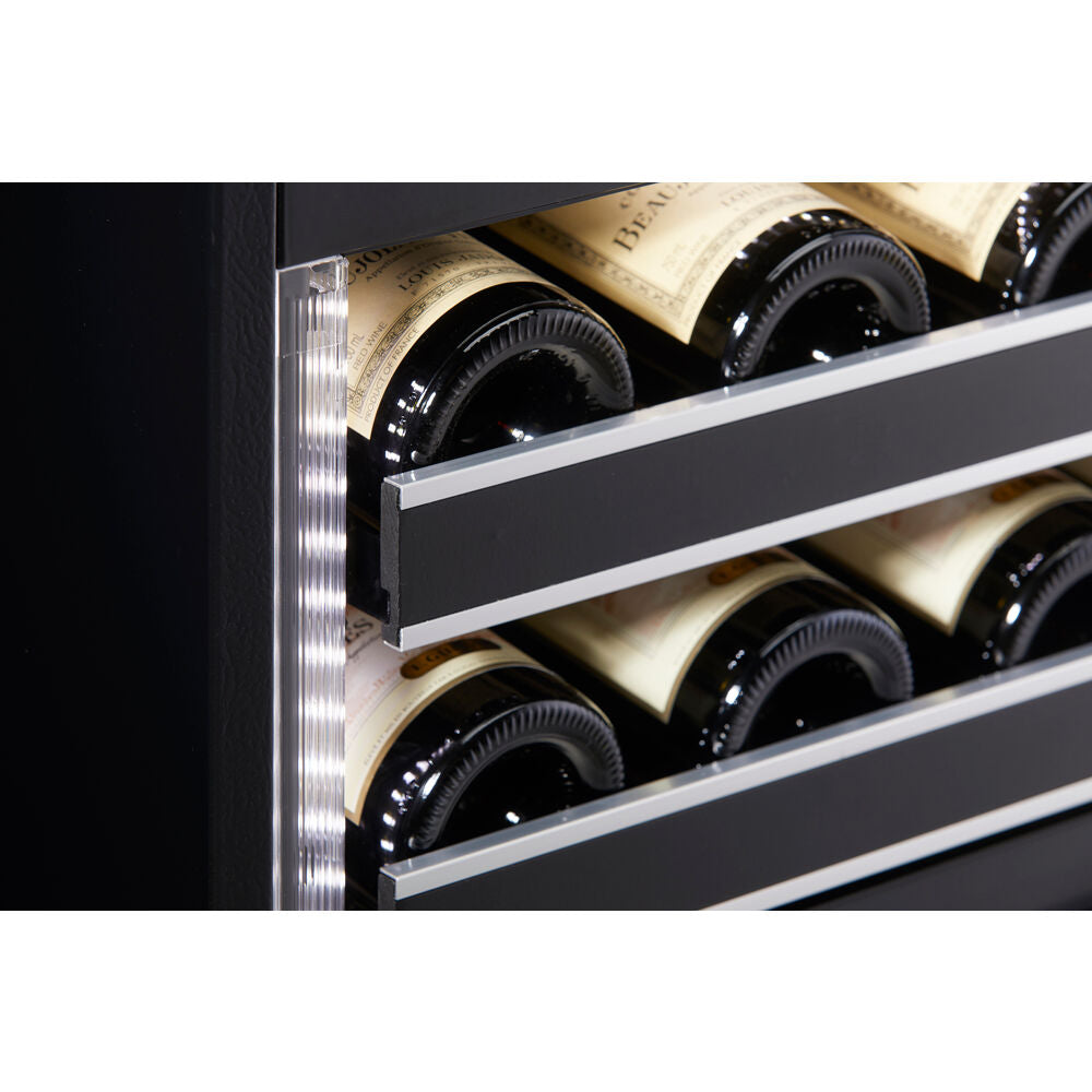 Close-up of wine bottles stored horizontally on metal racks inside a black under-counter wine cellar in kitchen appliances collection