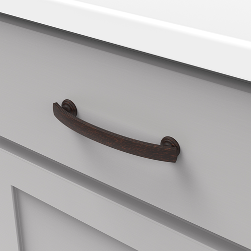 Vintage bronze-finished drawer pull with subtle curved design for cabinetry in home improvement collections