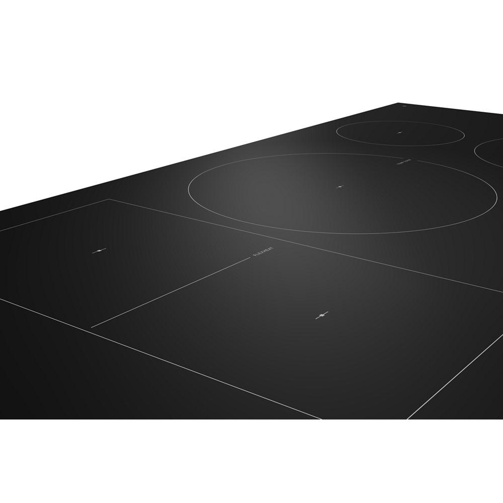Black smooth glass induction cooktop with four outlined cooking zones and subtle digital controls in appliance setting