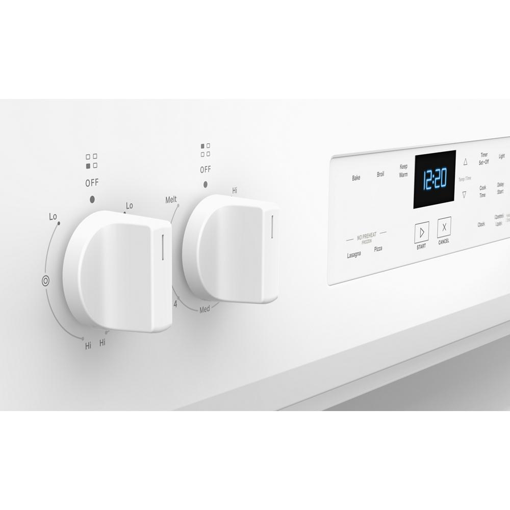 Close-up of white electric range control panel with dual knobs and digital display from kitchen appliances collection