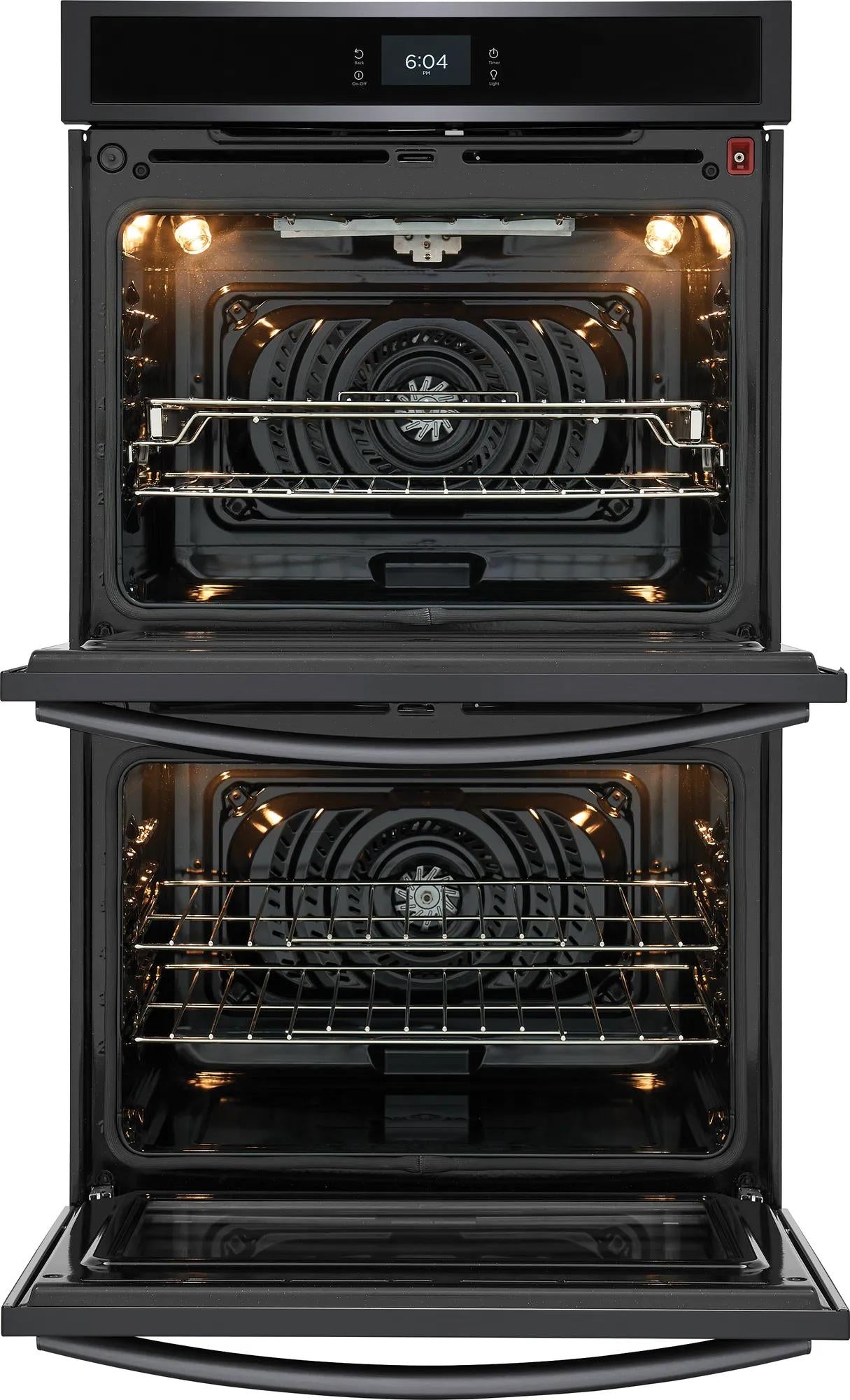 Open double electric oven with interior lights and convection fan in modern kitchen appliances at Hartville Hardware