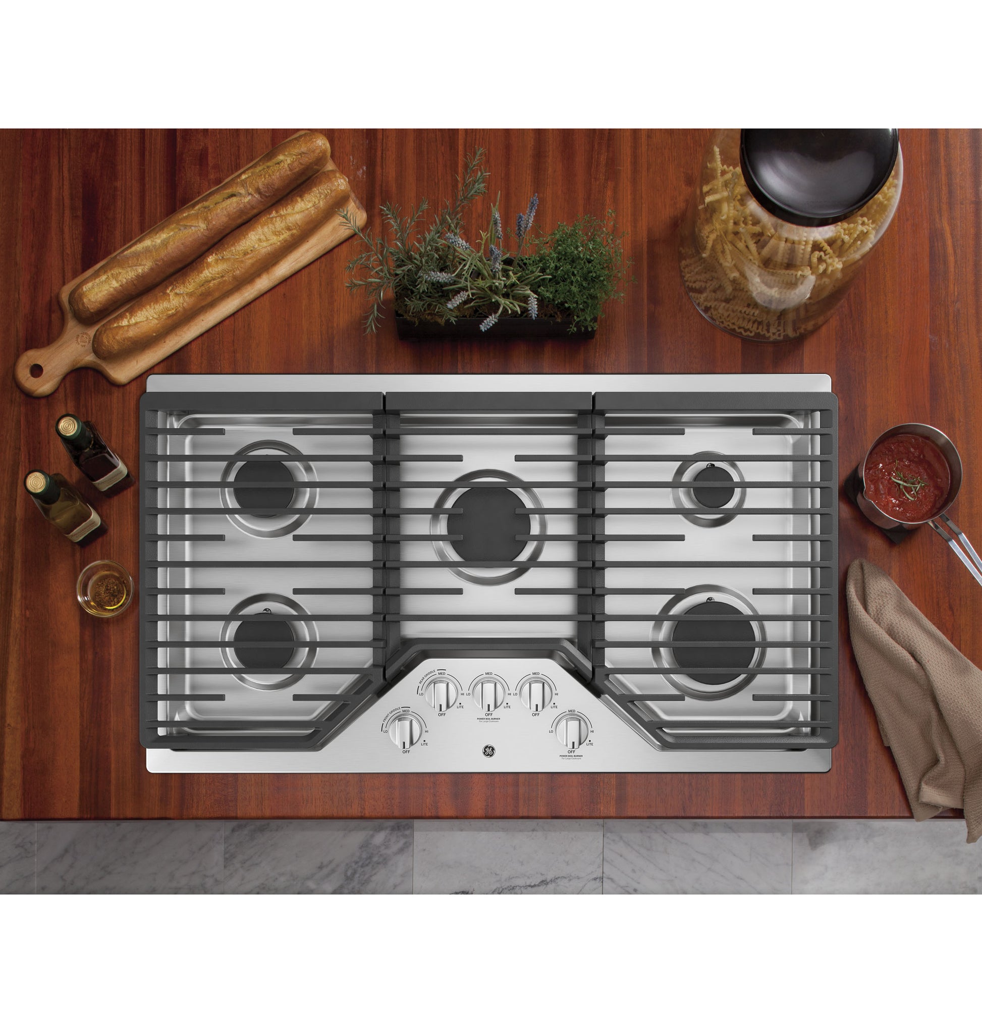 Stainless steel built-in gas cooktop with five burners and knob controls from Gas Cooktops collection