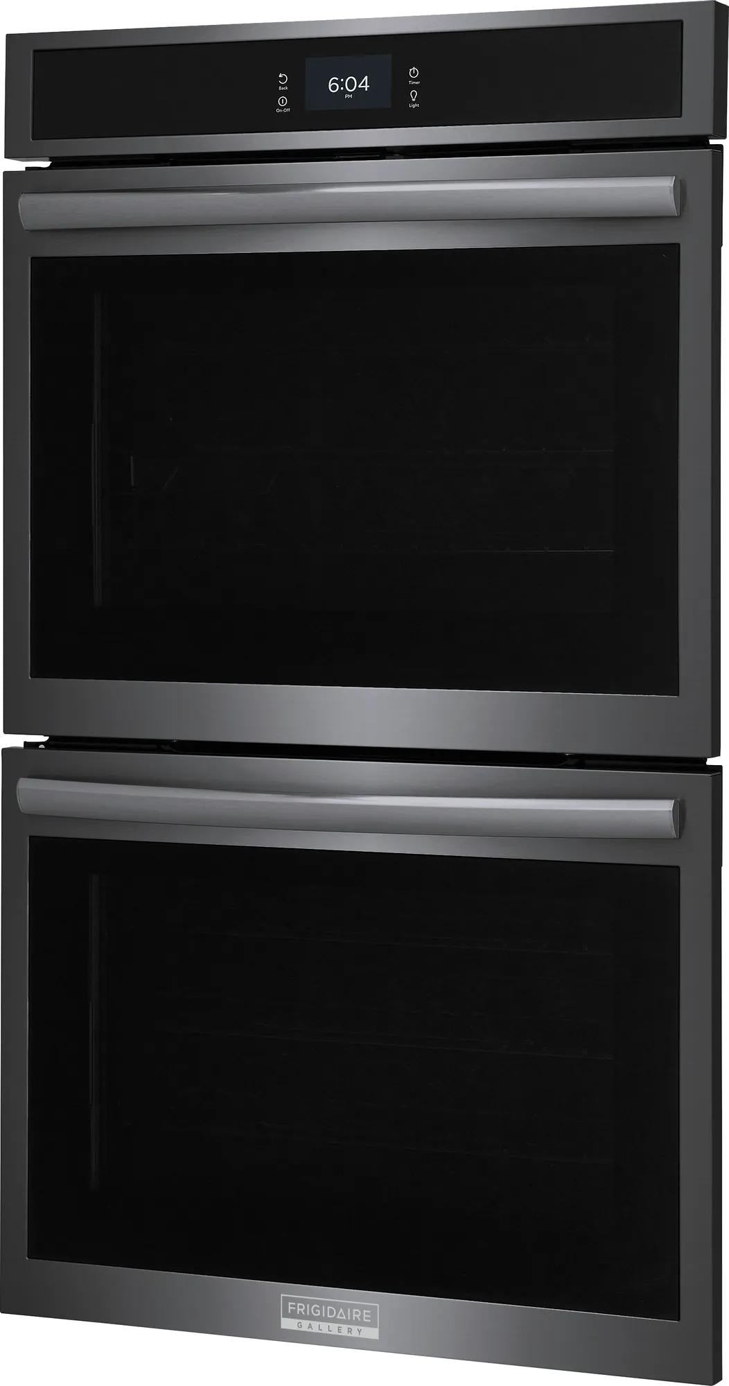 Sleek stainless steel double electric wall oven with digital display and wide horizontal handles in modern kitchen setting