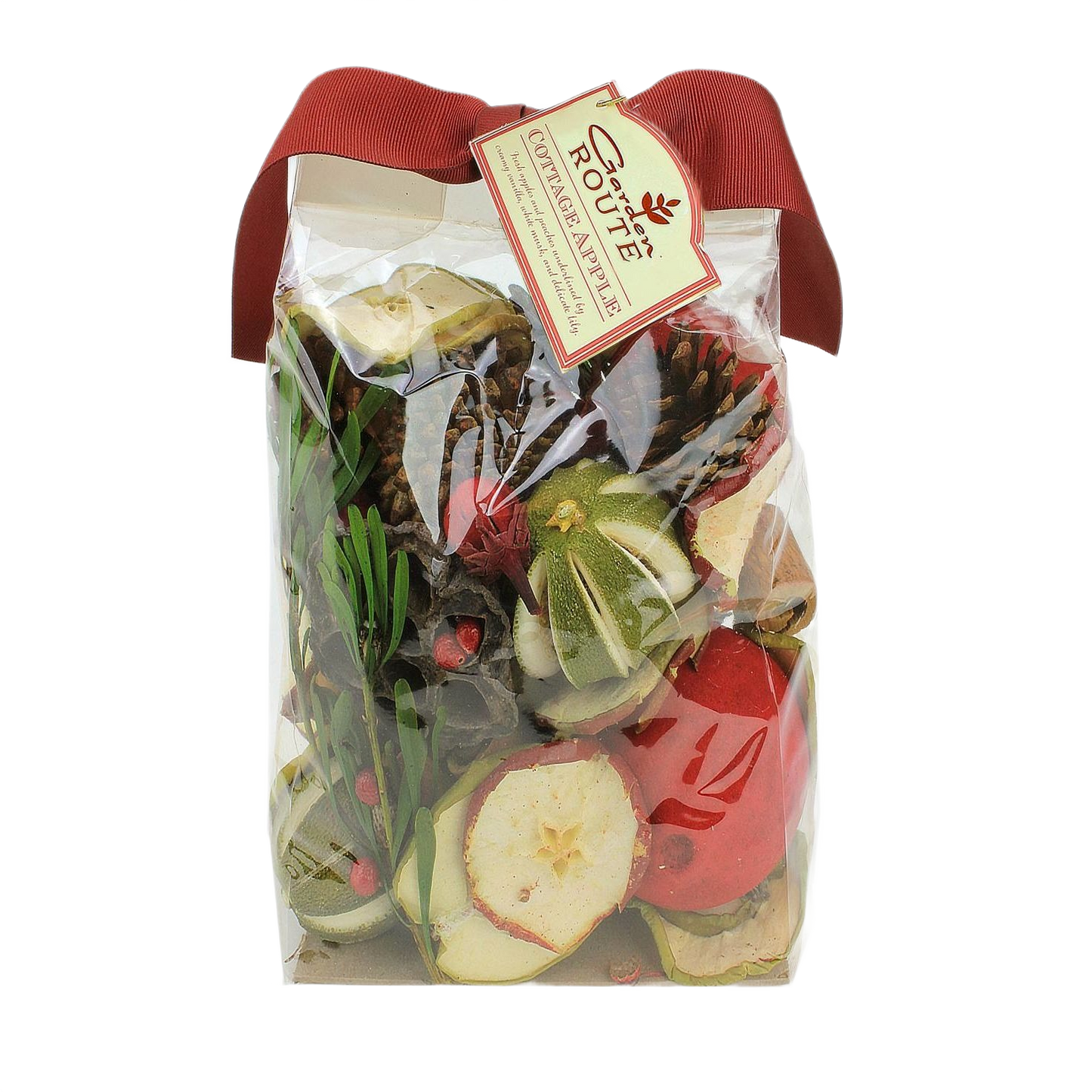 Clear bag of botanical potpourri with dried apple slices, pinecones, greenery, and red ribbon bow