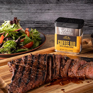 Traeger Coffee Rub container with grilled sliced steak and fresh salad for grilling sauces and spices collection