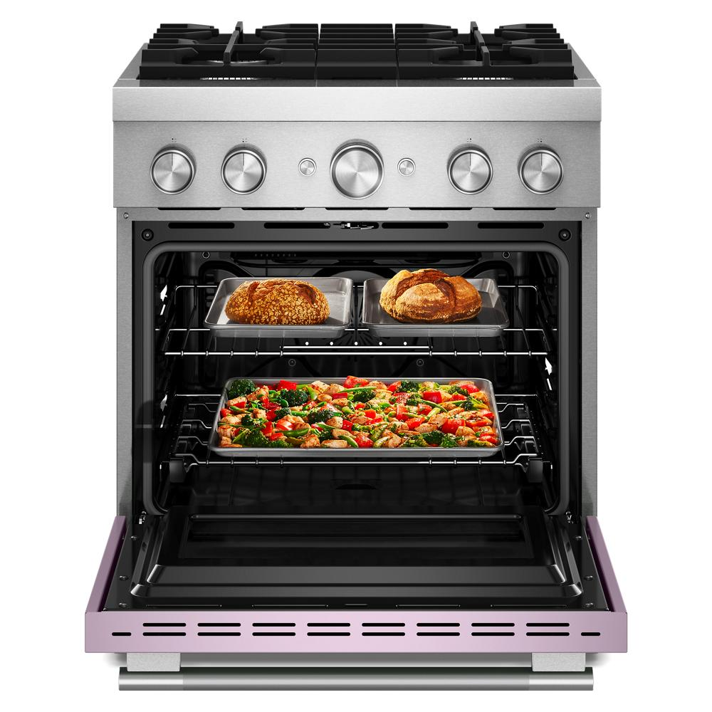 Open 30-inch dual fuel range oven with bread and vegetable pizza baking inside from KitchenAid collection
