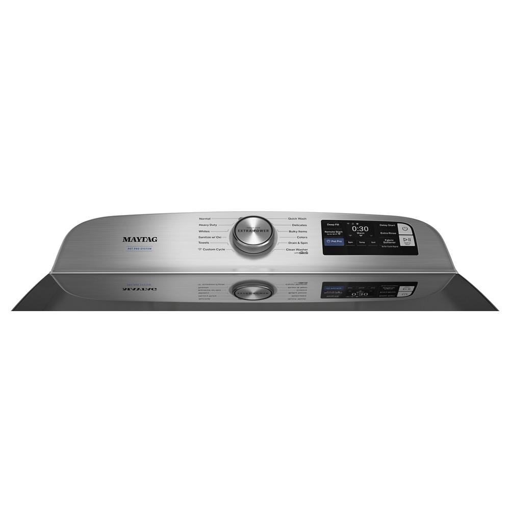 Top load washer control panel with cycle selector knob and digital display on stainless steel appliance surface