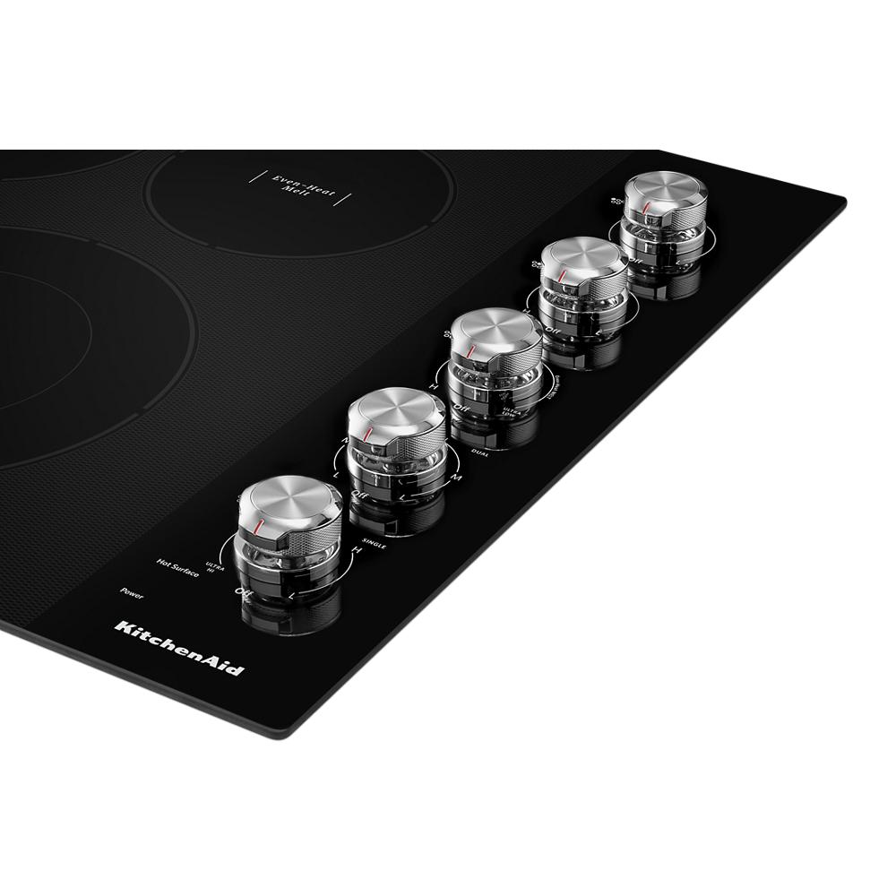 Black electric cooktop with five stainless steel knob controls in Cooktops and Kitchen & Kitchenware collections