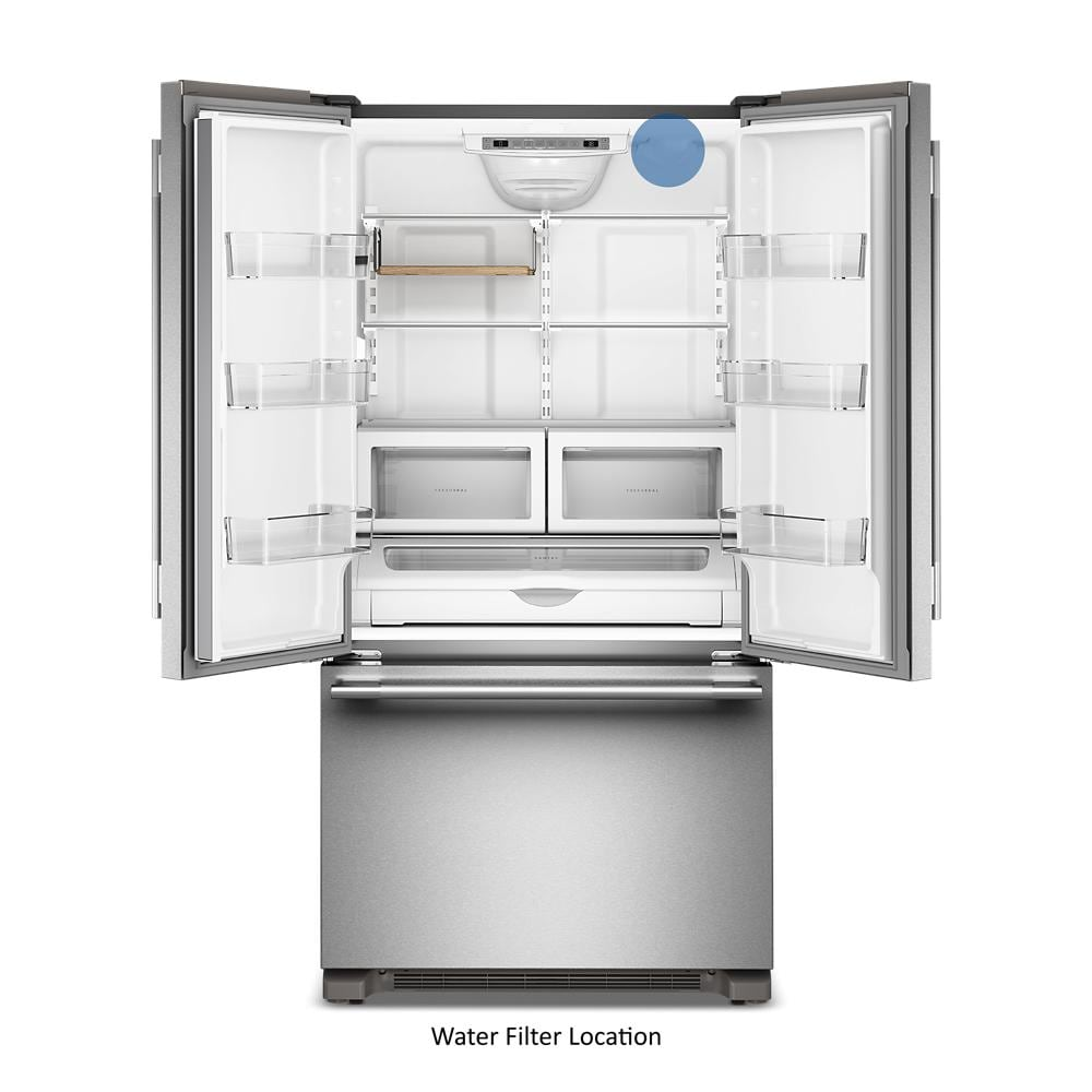 Open stainless steel French door refrigerator showing empty interior and bottom freezer drawer in KitchenAid appliances collection