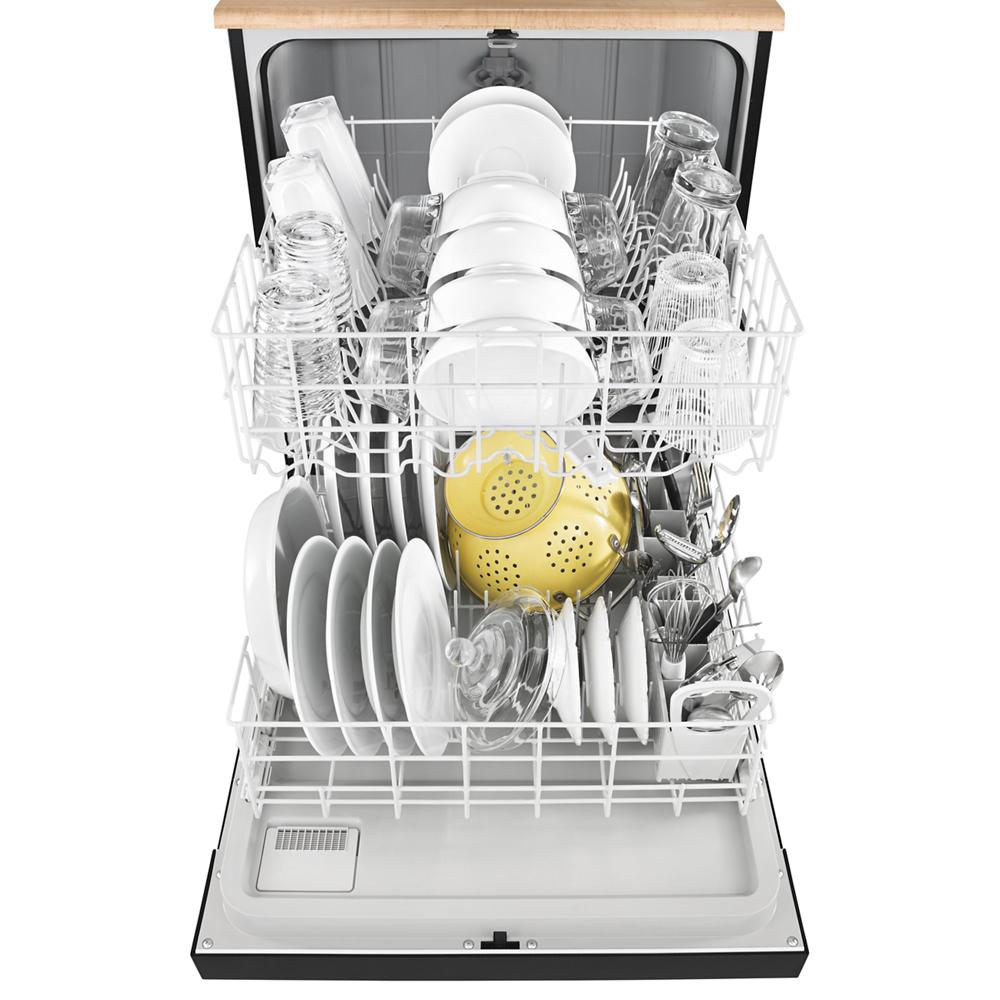 Open heavy-duty dishwasher filled with dishes, glassware, and kitchen utensils in modern kitchenware collection