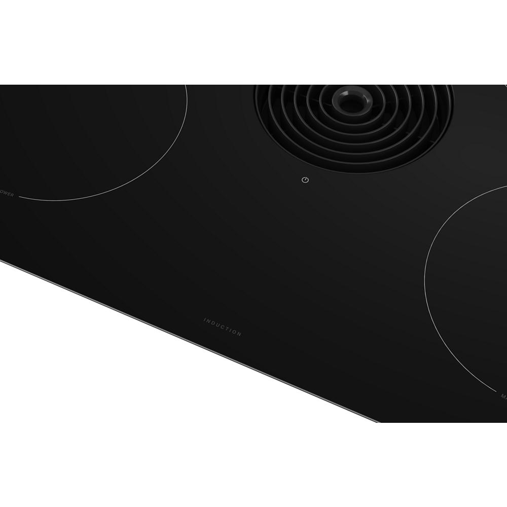 Black induction cooktop with four cooking zones and integrated downdraft vent from KitchenAid cooktops collection