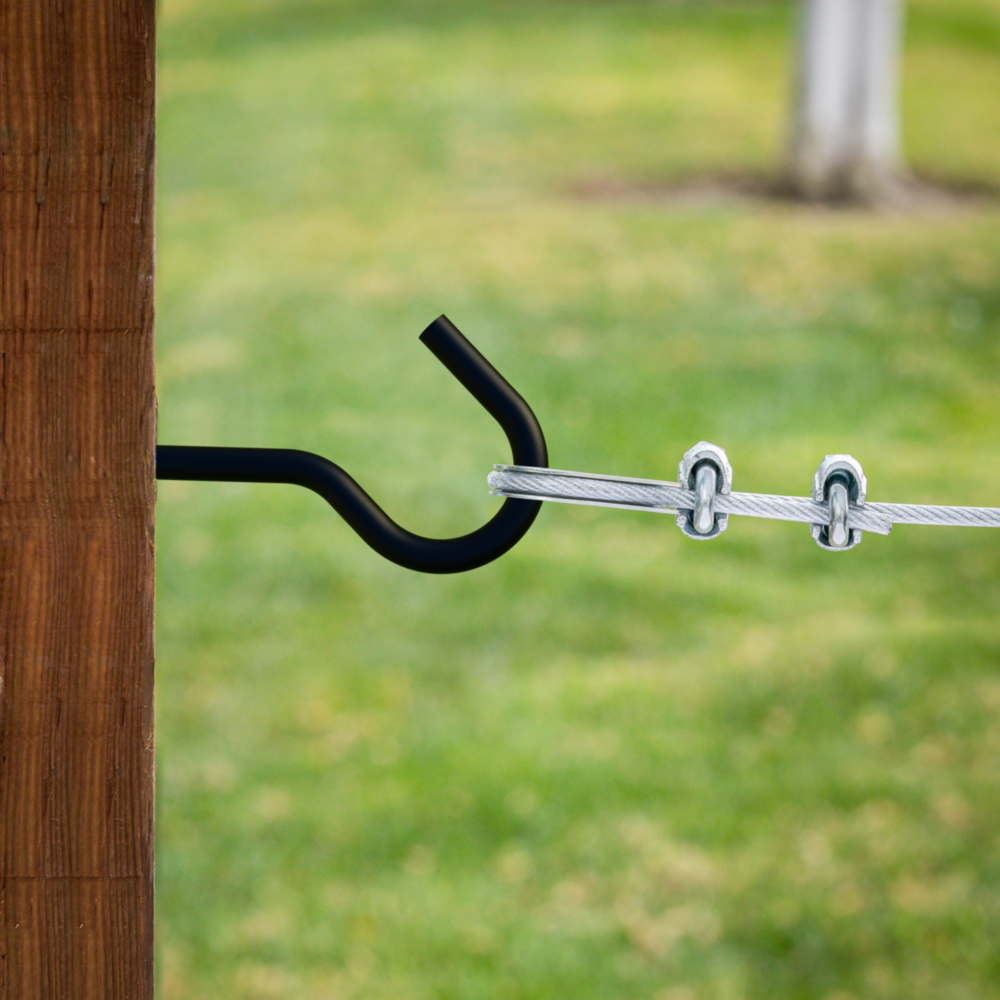 Black coated screw hook mounted in wood holding metal wire with cable clamps for garage storage and organization projects under $50