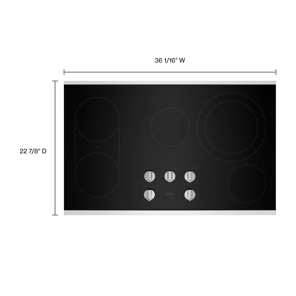 Black electric cooktop with five control knobs and five heating zones for electric cooktops and kitchen appliances collections
