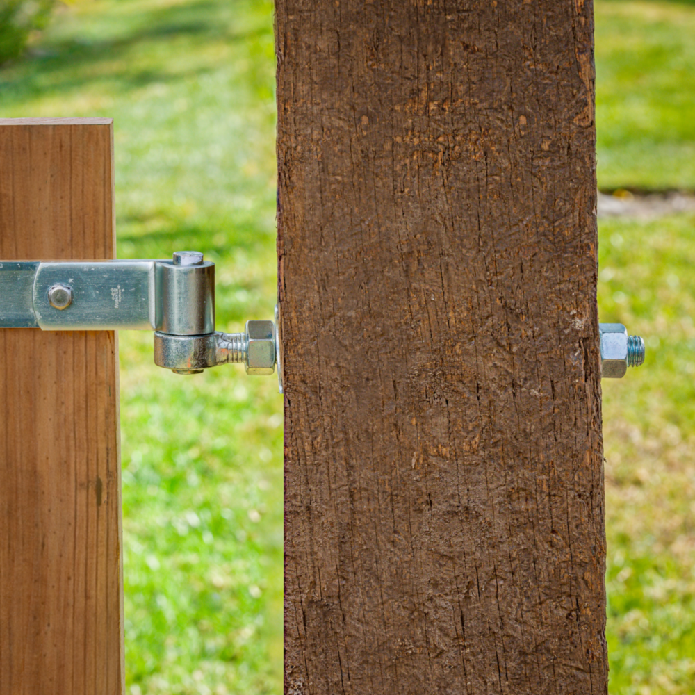 Adjustable zinc bolt hook securing wooden gate post in door accessories and hardware for home improvement projects under $50