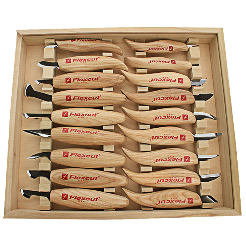 Wood-handled carving knives neatly arranged in wooden storage box for woodworking and home improvement tasks
