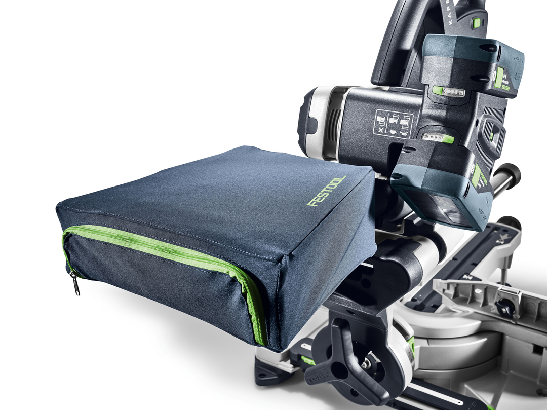 Close-up of cordless sliding compound miter saw with attached dust collection bag for clean home improvement projects
