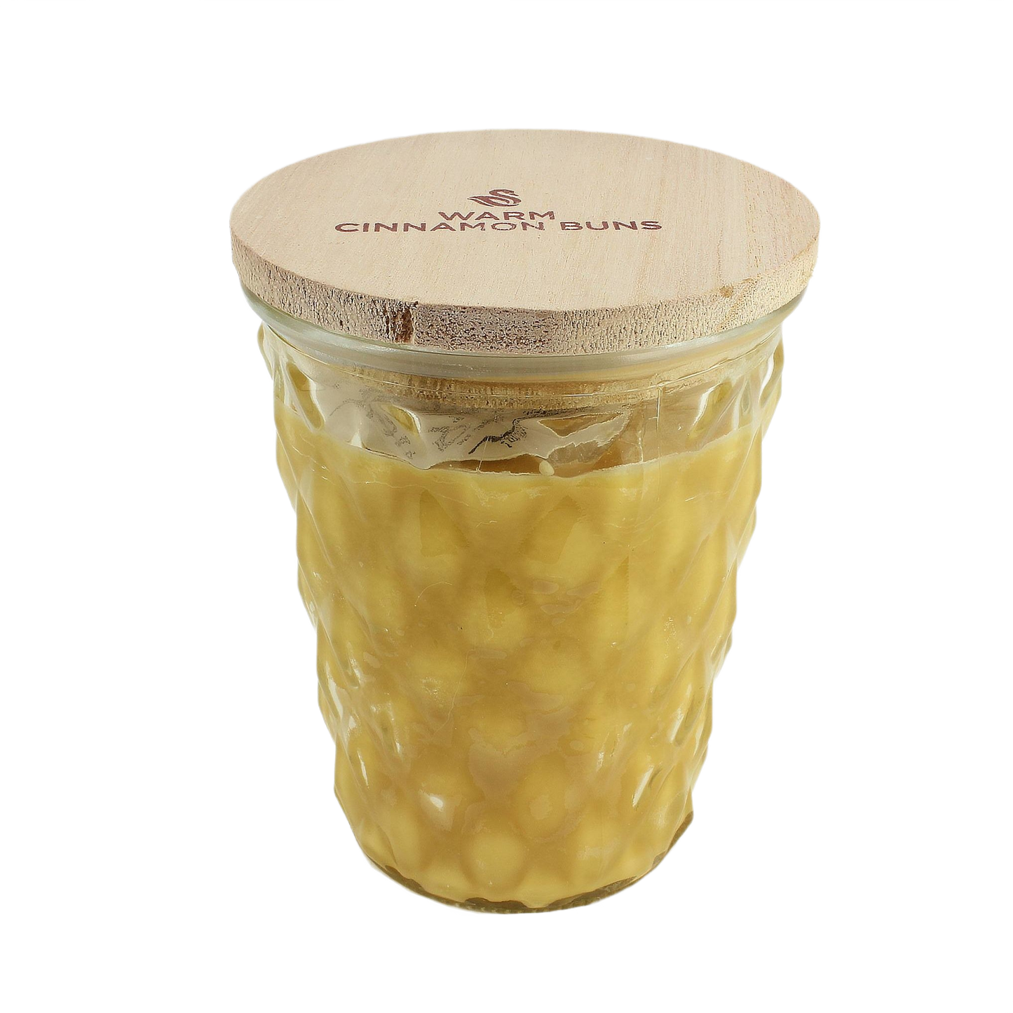 Glass jar candle with textured surface and wooden lid labeled Warm Cinnamon Buns for cozy home ambiance