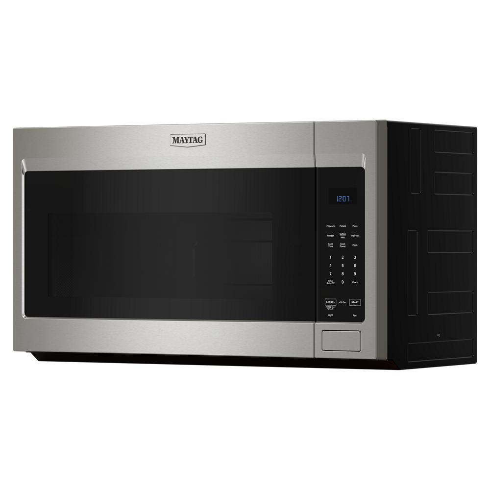 Angled view of stainless steel over-the-range microwave with digital keypad in Appliances and Kitchen & Kitchenware collections
