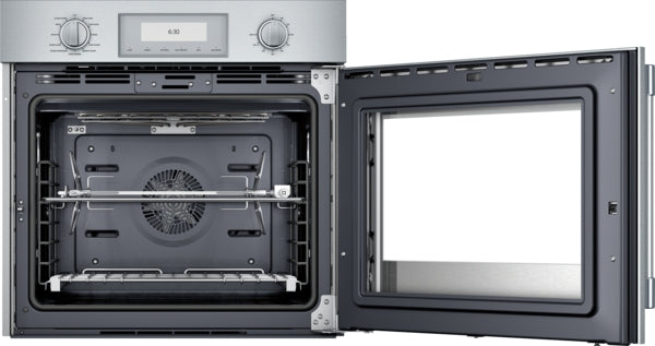 Open stainless steel single wall oven with visible interior fan, rotisserie rod, and digital control panel from Thermador collection