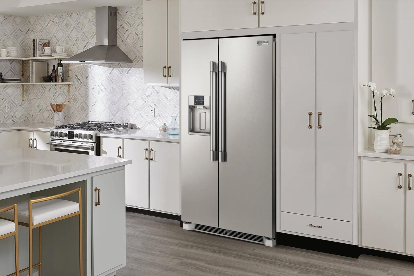 Stainless steel 22 Cu. Ft. counter-depth side-by-side refrigerator in modern kitchen with white cabinetry and appliances