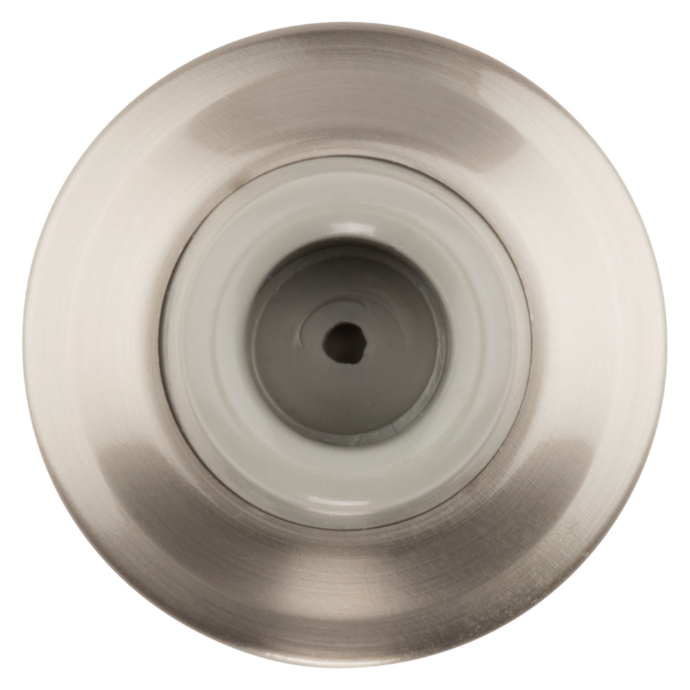 Top view of solid brass wall door stop with large round base and protective rubber buffer in door accessories collection
