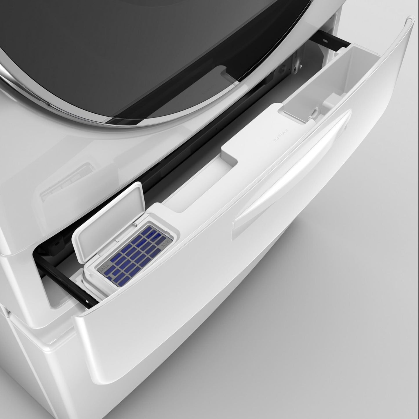 Open detergent drawer of white front load washer showing Load & Go XL dispenser compartment in modern appliance setting
