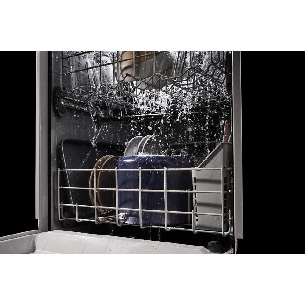 Interior of quiet dishwasher spraying water over dishes in racks from kitchenware and appliances collection