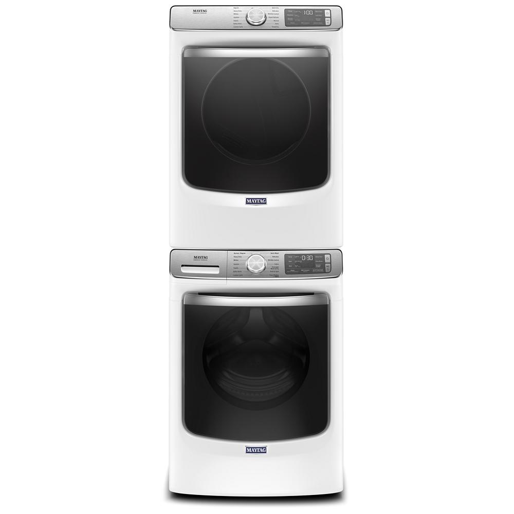 Stacked white front load washer and dryer with silver control panels from washers and dryers collection