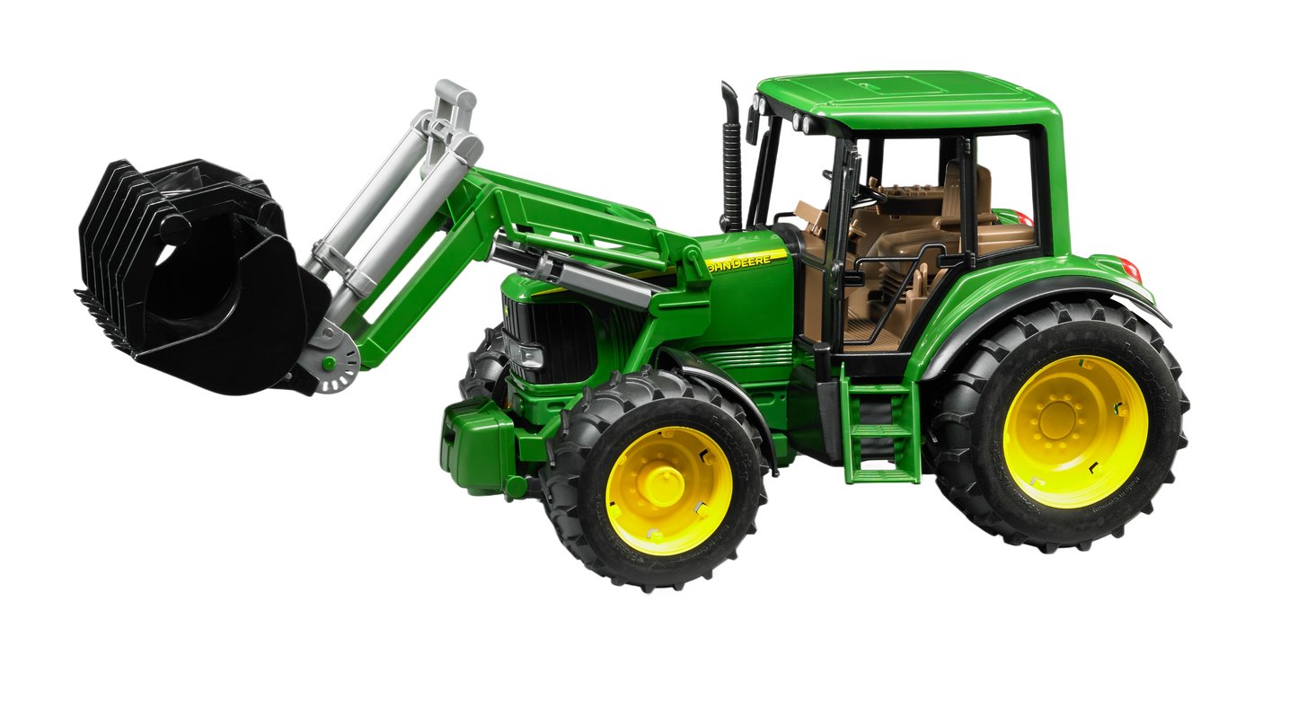 Green and yellow Bruder John Deere 6920 toy tractor with frontloader bucket and realistic cabin details for play or display