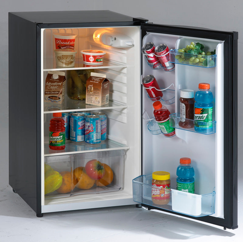 Compact black counterhigh refrigerator with open door showing organized shelves stocked with drinks and food items