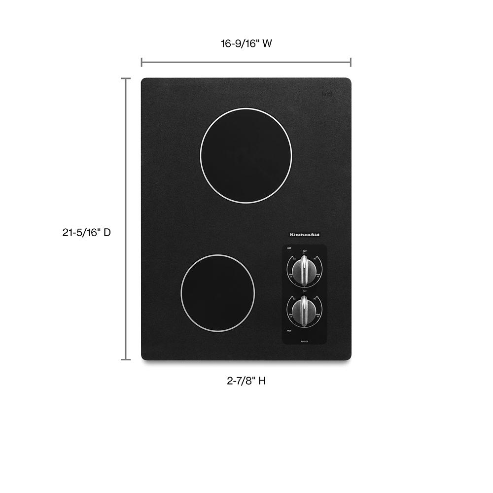 Compact black electric cooktop with two radiant elements and control knobs in KitchenAid appliances collection