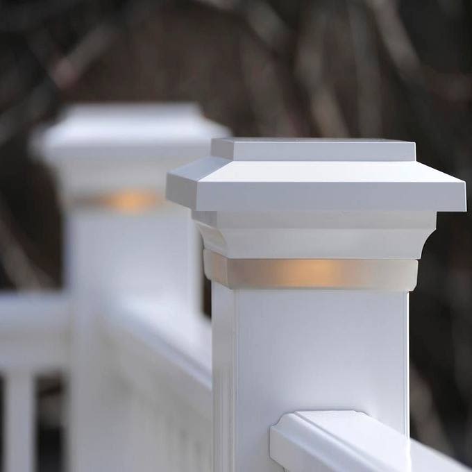 Frosted white LED post cap light installed on 4x4 outdoor railing posts for home improvement lighting tasks