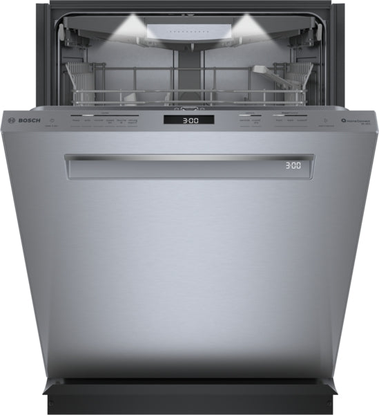 Open stainless steel dishwasher with illuminated interior and digital display in modern kitchen appliance setting