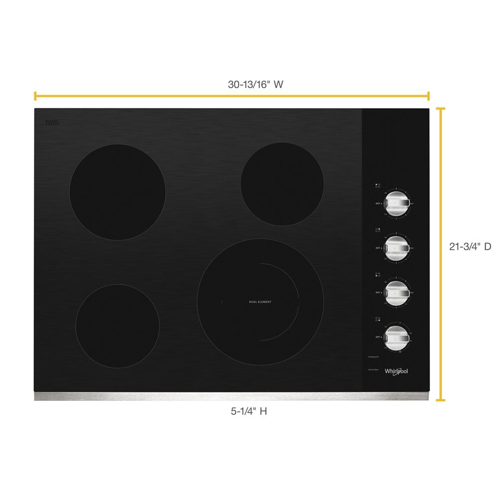 Black electric ceramic glass cooktop with four radiant heating zones and metallic control knobs for kitchen appliances and home improvement