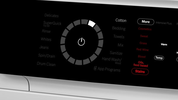 Close-up of black control panel on compact front load washer showing cycle options and digital settings display