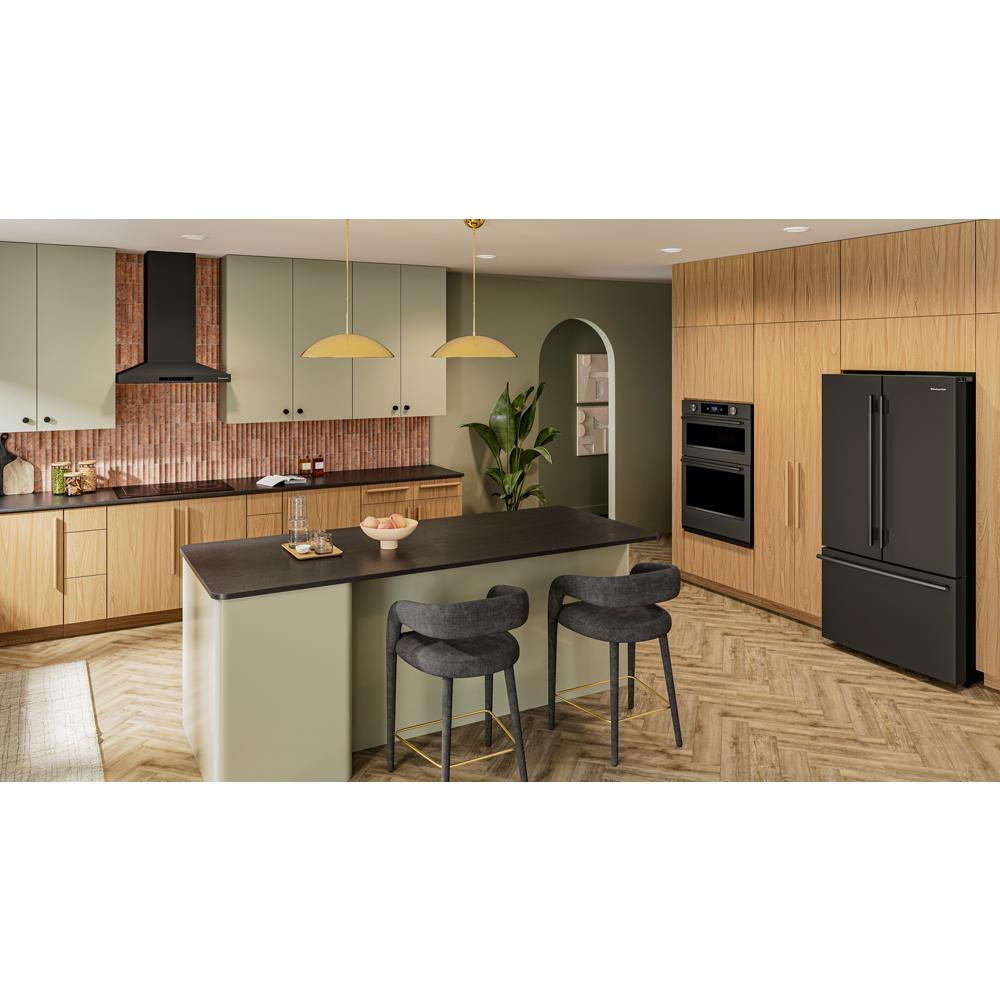 Modern kitchen with black wall-mount canopy hood, olive green cabinets, black countertop island, and wood flooring.
