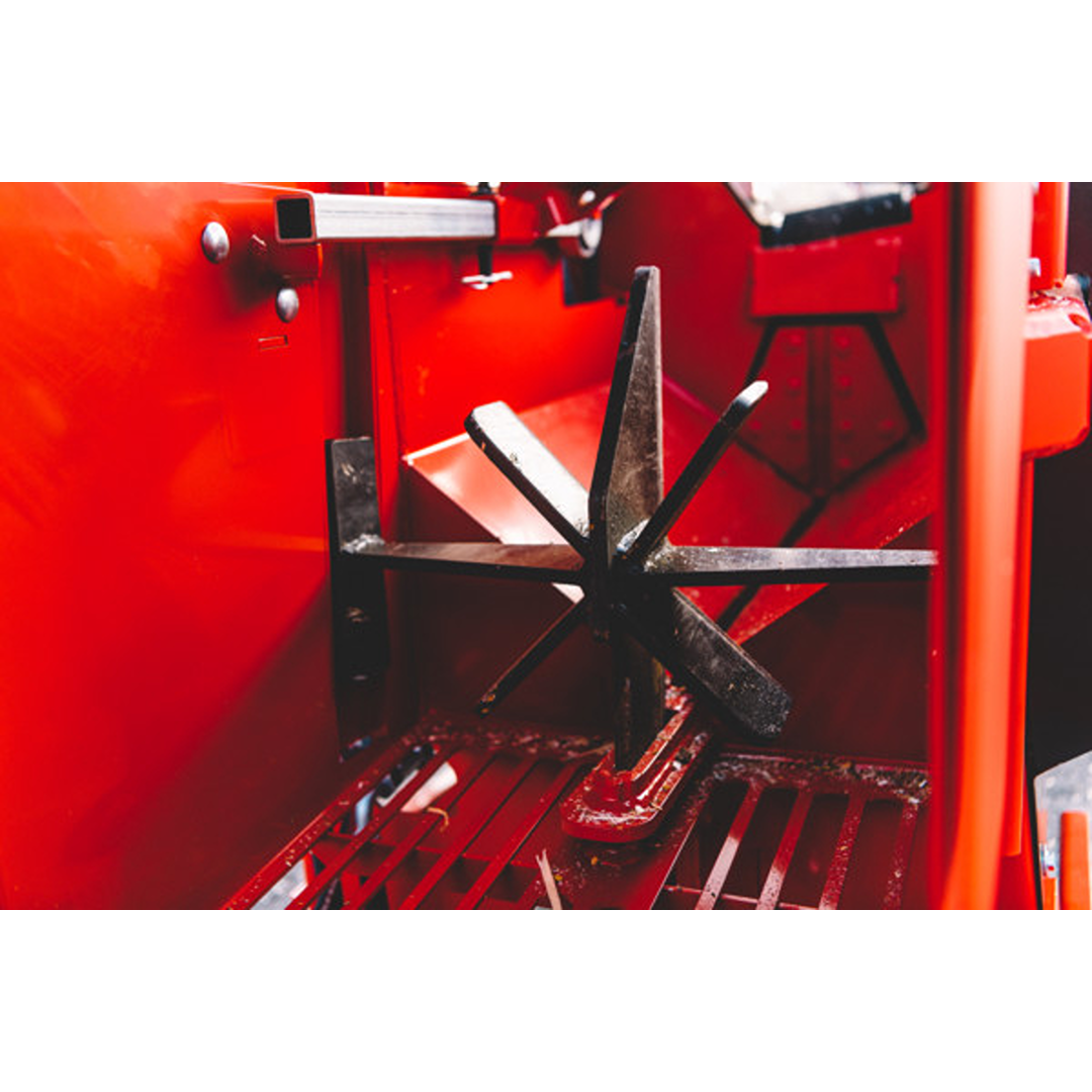 Close-up of metal splitting wheel mechanism inside red firewood processor from Japa log splitters collection