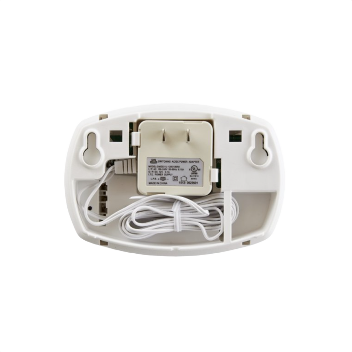 Back view of white carbon monoxide detector adapter with power plug and coiled white cord for electrical safety collections