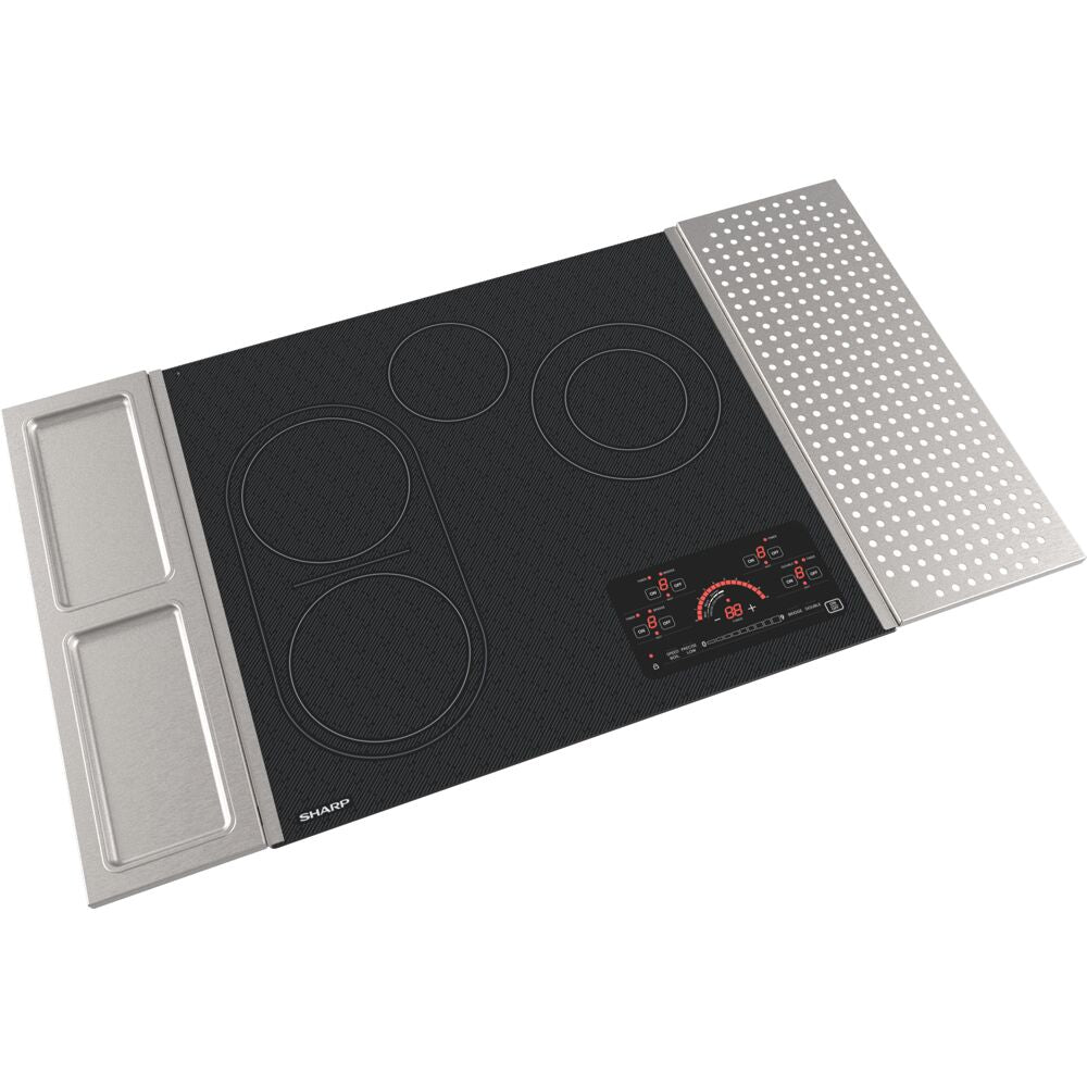Electric cooktop with four heating zones, black glass surface, touch controls, and stainless steel side trays for kitchenware collections