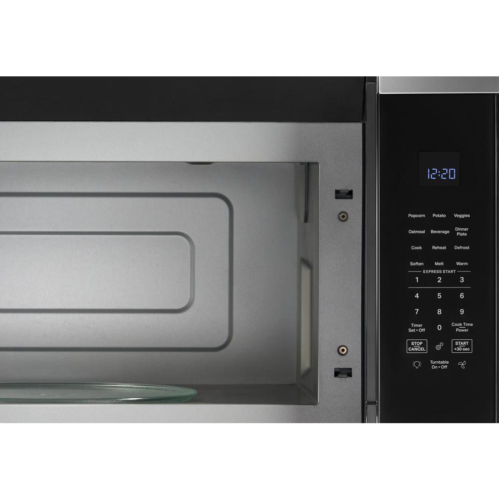 Interior view of over the range microwave with digital control panel showing preset sensor cooking options in appliances collection