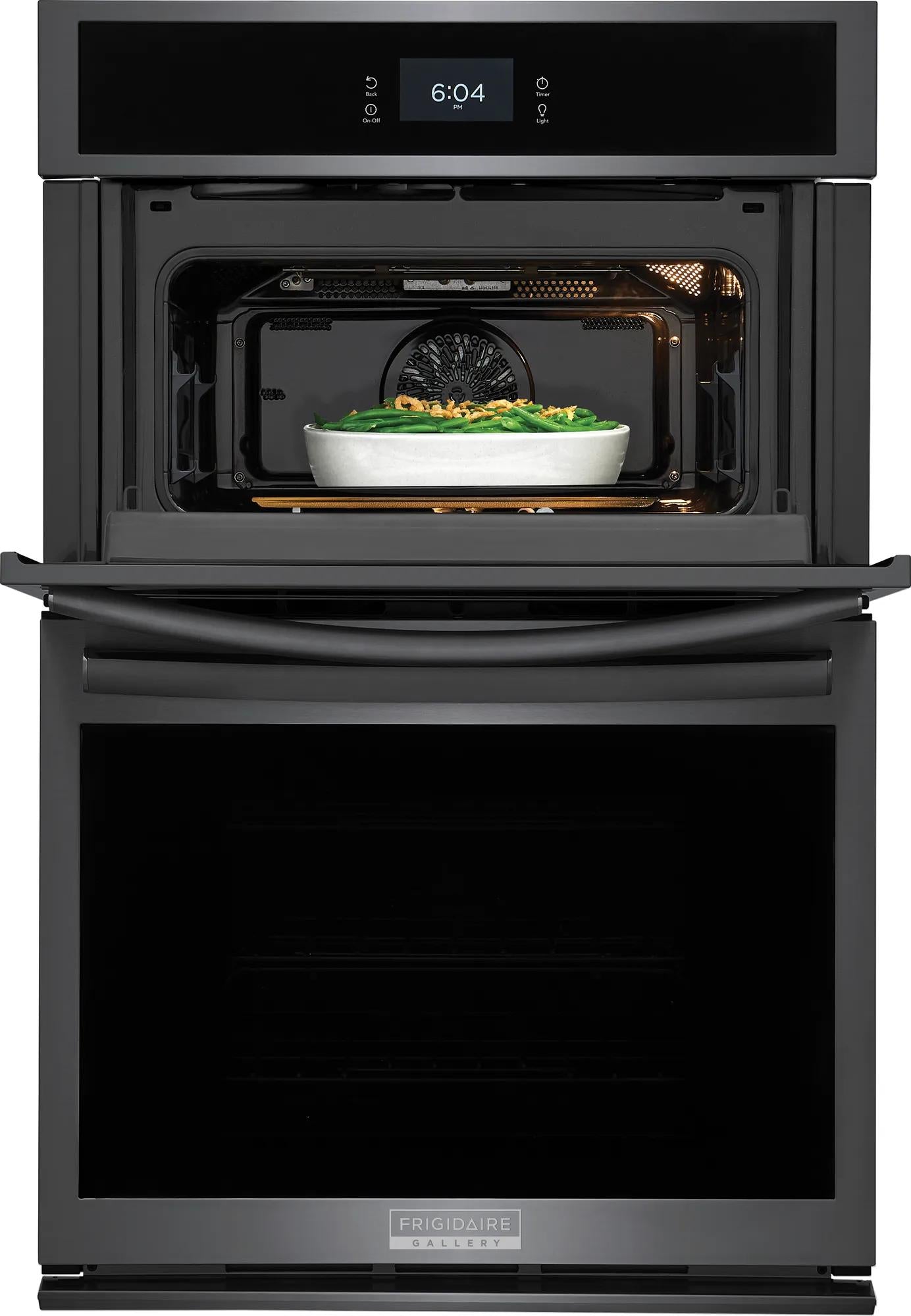 Black electric wall oven with microwave and digital clock displaying time from kitchen and appliances collections