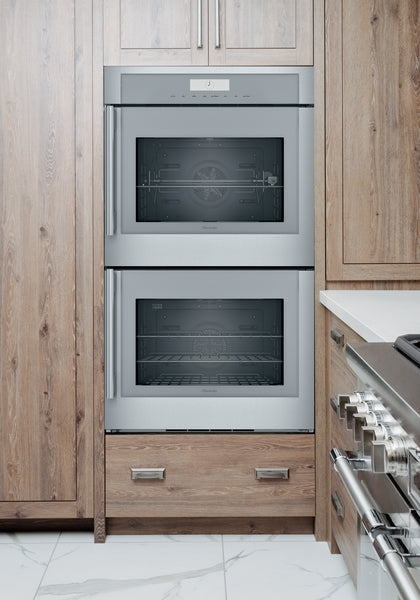 Built-in stainless steel double wall oven with side opening doors in modern kitchen and Thermador appliances collection